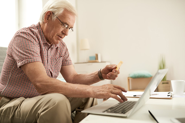 man-looking-at-creditcard